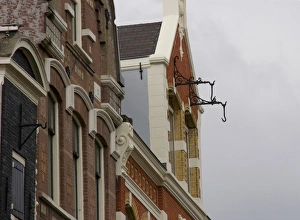 Images Dated 6th September 2007: Hooks hanging from brick building in Amsterdam for pully system