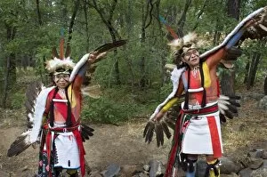 Hopi-Tewa eagle dancers dressed in traditional regalia of woven apron, sash, moccasins