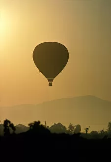 Images Dated 21st April 2005: Hot air balloon lifting over Napa valley at sunrise