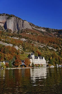 Hotel in autumn, along shore of Lake Lucerne from sightseeing boat, Lake Lucerne
