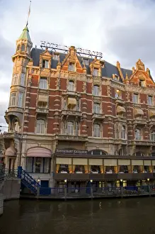 Nederland Prints: Hotel de L Europe along the Amstel River in Amsterdam, Netherlands