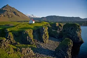 Images Dated 28th June 2007: House near basaltic columns with Snaefellsjokull Volcano in the background