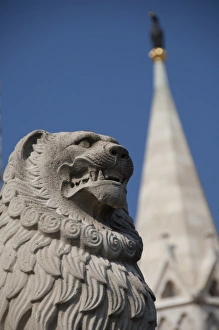 Hungary, capital city of Budapest. Buda, Castle Hill, lion statue in front of castle