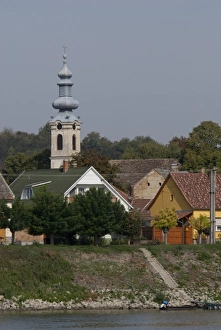 Images Dated 12th September 2009: Hungary. Danube River view near Kalocsa. Typical waterfront village with clock tower