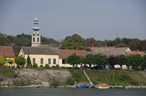 Images Dated 12th September 2009: Hungary. Danube River view near Kalocsa. Typical waterfront village with clock tower