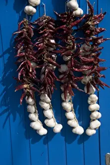 Home Grown Prints: Hungary, Kalocsa. Fresh garlic and local sweet paprika hanging on blue door