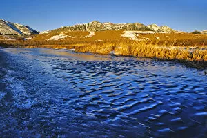 Ice Ripples on pond in Waterton Lakes National Park in Alberta Canada