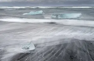 Blurred Prints: icebergs on black volcanic beach