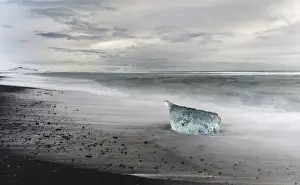Lonely Prints: icebergs on black volcanic beach