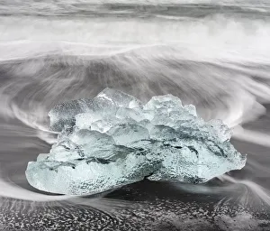 Icebergs on black volcanic beach near the Jokulsarlon glacial lagoon and Breithamerkurjokull