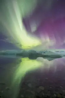 Iceland, Jokulsarlon. Aurora lights reflect in lagoon