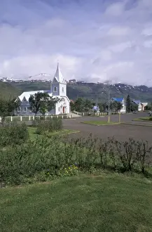 Small Town Prints: Iceland, Seydisfjordur Blue church in town harbor; fishing port