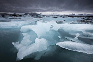 Images Dated 28th July 2009: Iceland, Skaftafell National Park, Storm clouds loom above icebergs from Vatnajokull