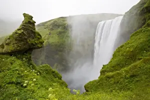 Images Dated 18th July 2009: Iceland. Skogarfoss Waterfall plunges over a volcanic cliff. Credit as: Don Grall