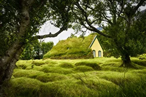 Prints of Iceland, turf-roofed Hof Church and surrounding grave mounds Images Dated 2019 January: Iceland, turf-roofed Hof Church and surrounding grave mounds