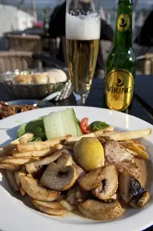 Icelandic Prints: ICELAND20739_JUL2009_BARTRUFF. CR2-Fish and chips Icelandic style is served at a rooftop