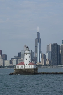 Lakefront Prints: Illinois, Chicago, Lake Michigan. Historic Chicago Harbor Light with Chicago city skyline