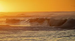 Poipu Prints: Incoming surf waves at sunrise near Poipu in Kauai, Hawaii, USA