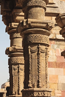Carving Prints: India, Delhi. Carved stone columns at Qutub Minar