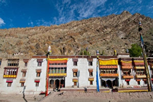 Tibetan Prints: India, Jammu & Kashmir, Ladakh, Hemis Monastery facade with craggy cliff in the background