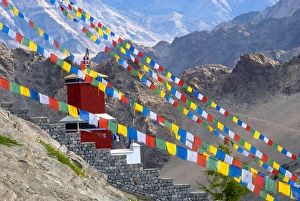 Images Dated 1st July 2012: India, Jammu & Kashmir, Ladakh, Leh, strings of prayer flags and a small red structure