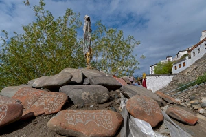 Images Dated 26th June 2012: India, Jammu & Kashmir, Ladakh, Leh, prayer stones and flags in front of Thiksey
