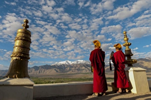 Images Dated 1st July 2012: India, Jammu & Kashmir, Ladakh, Leh, two monks playing horns at sunrise on the roof