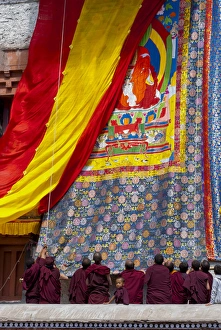 Tibetan Prints: India, Jammu & Kashmir, Ladakh, monks raising the embroidered thangka during