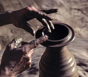 Skill Prints: India, Kashmir, Srinagar. A potters skilled hands shape a new pot in Srinagar