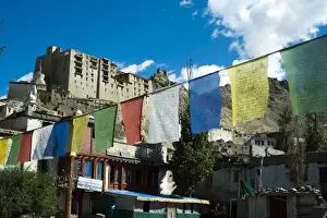 Tibetan Prints: India, Ladakh, Leh, prayer flags with Leh palace in background