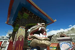 Tibetan Prints: India, Ladakh, Leh, small colorful buddhist temple with dragon figure and Leh Palace