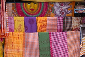 Uttar Pradesh Prints: India, Uttar Pradesh, Varanasi. bright pieces of colored cloth for sale along