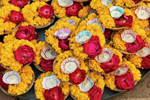 South Asia Prints: India, Uttar Pradesh, Varanasi, Bangali Tola. Selling offerings of flowers and candles