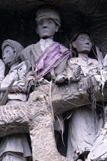Indonesia, Sulawesi, Tana Toraja region. Tau tau, effigies of departed nobles, guard