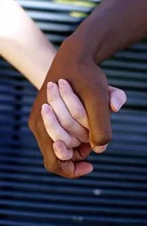 Images Dated 9th May 2007: Interracial couple holding hands. MR