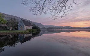 Ireland, Cork, Gougane Barra. Church and mountain reflections in lake