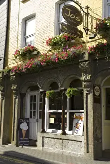 Main Street Prints: IRELAND, County Cork, Kinsale. Ice cream shop on Main Street