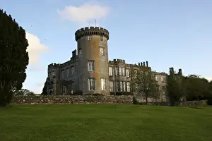 15th Century Prints: In Ireland, the Dromoland Castle turret grounds and green lawn with blue sky white clouds