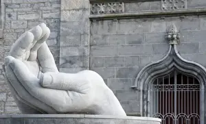 Ennis Prints: Ireland, Ennis. Stone sculpture of a pair of hands outside the Cathedral of Saints Peter and Paul