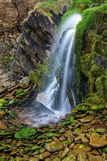 Images Dated 26th November 2022: Ireland, Ferriter's Cove. Close-up of waterfall and mossy rocks