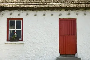 Cottage Prints: Ireland, Gleann Cholm Chille. Details of a thatched-roof cottage with a red door