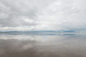 Ireland Prints: Ireland, Inch Strand. Landscape with fog on ocean and beach