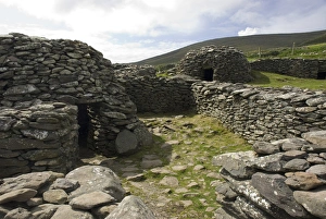 Images Dated 29th July 2009: IRELAND, Kerry, Dingle Peninsula. Ancient Beehive Huts