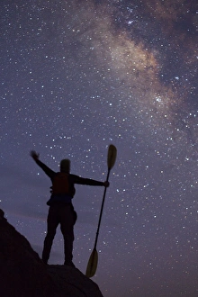 Images Dated 9th April 2011: Isla Carmen, Sea of Cortez, Baja, Mexico. A kayaker in silhouette lifts his arms