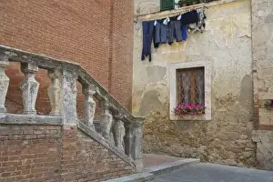 Laundry Prints: Italy, Asciano, Window Boxes with Fresh Spring Flowers and Laundry Hanging on The Line
