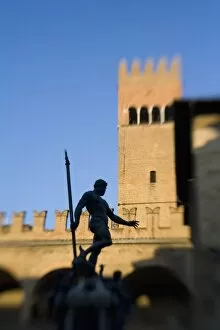 Italy, Bologna, Selective Focus of The Statue of Nettuno with warm evening light