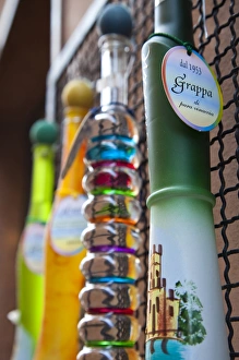 Images Dated 22nd May 2009: ITALY, Brescia Province, Sirmione. Ornate bottles of grappa