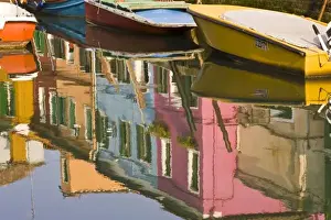 Images Dated 22nd August 2008: Italy, Burano. Boats on a canal with reflections of colorful houses on the water