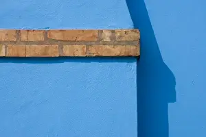 Chimney Prints: Italy, Burano. Close-up of blue stucco exterior of chimney and colored brick