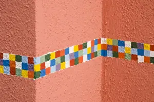 Burano Prints: Italy, Burano. Decorative checkerboard border painted on a house